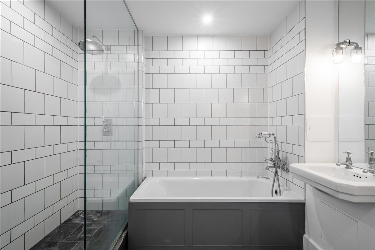Bathroom - A stunning three-bedroom, two-bathroom split-level “sky house” apartment set across the fifth and sixth floors in the heart of London Fields.