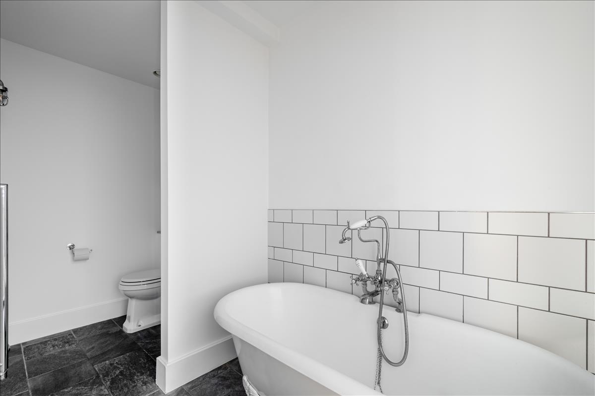 Bathroom - A stunning three-bedroom, two-bathroom split-level “sky house” apartment set across the fifth and sixth floors in the heart of London Fields.