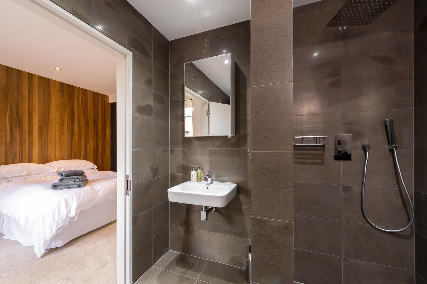 stylish modern large apartment Shoreditch master suite bathroom