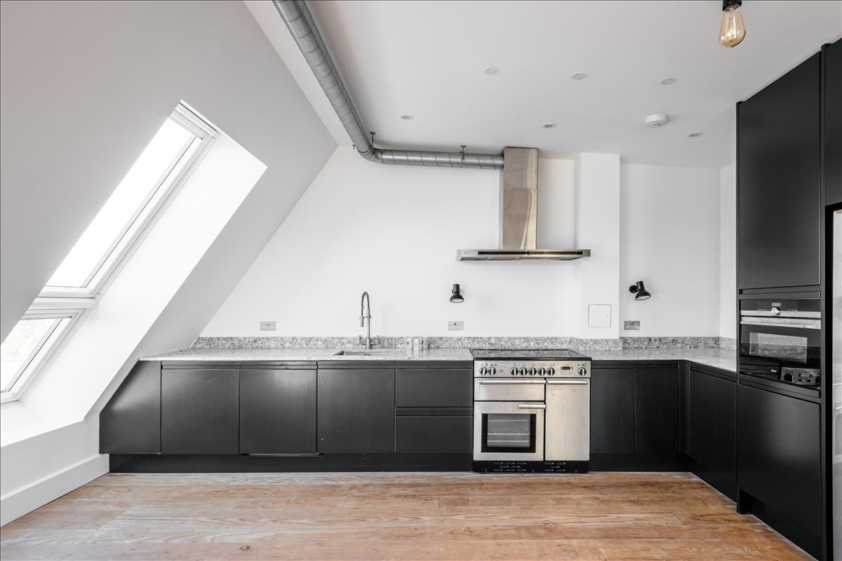 Kitchen - A stunning three-bedroom, two-bathroom split-level “sky house” apartment set across the fifth and sixth floors in the heart of London Fields.