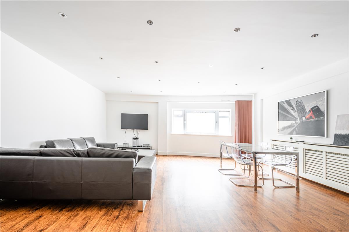 Living Room - An exceptional three-bedroom, two-bathroom split-level apartment, ideally situated in the heart of London’s renowned jewellery quarter, Hatton Garden.