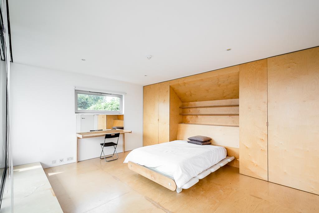 Modern bright architecturally designed house Shoreditch master bedroom built in storage