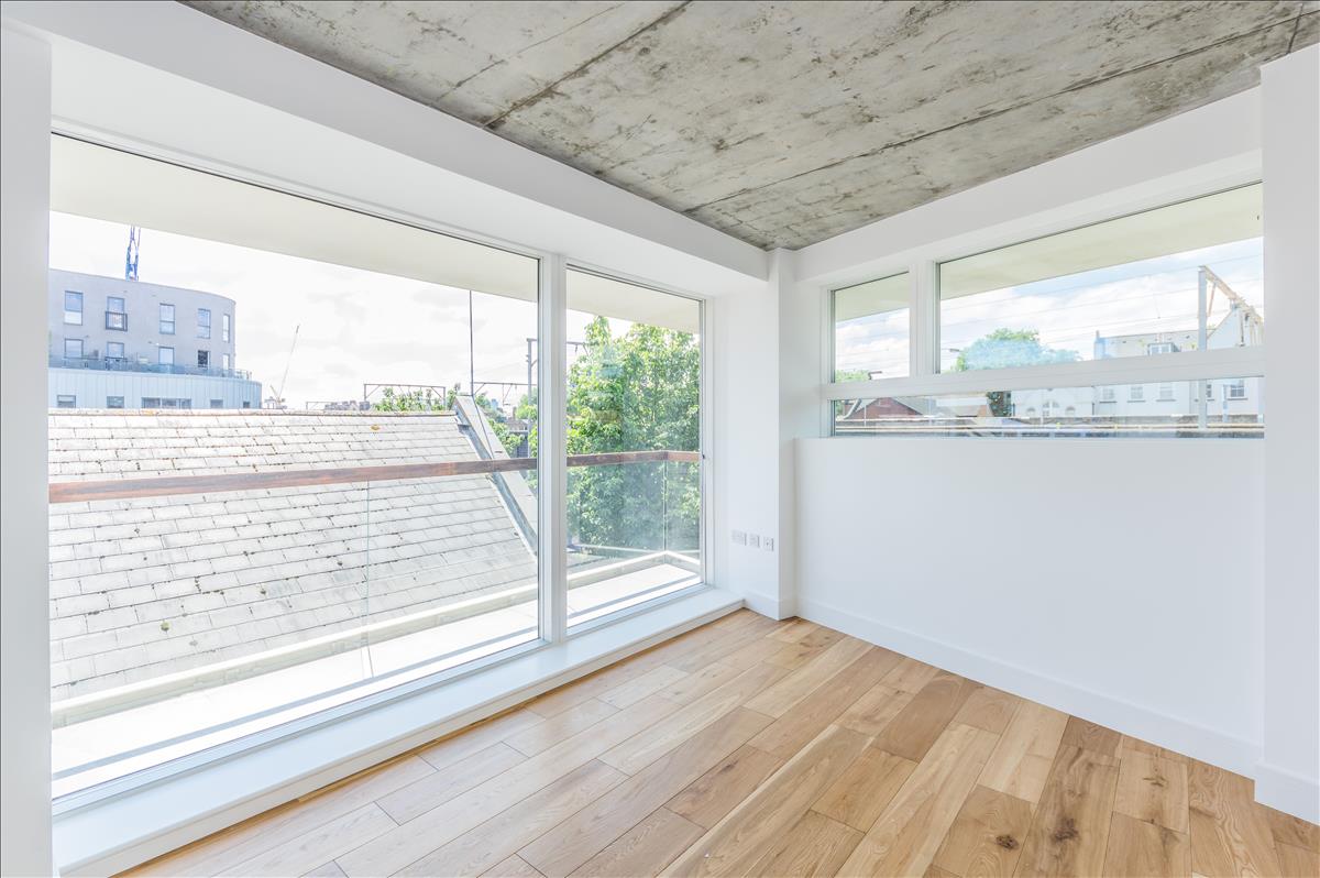 New build apartment London Fields master bedroom balcony bright