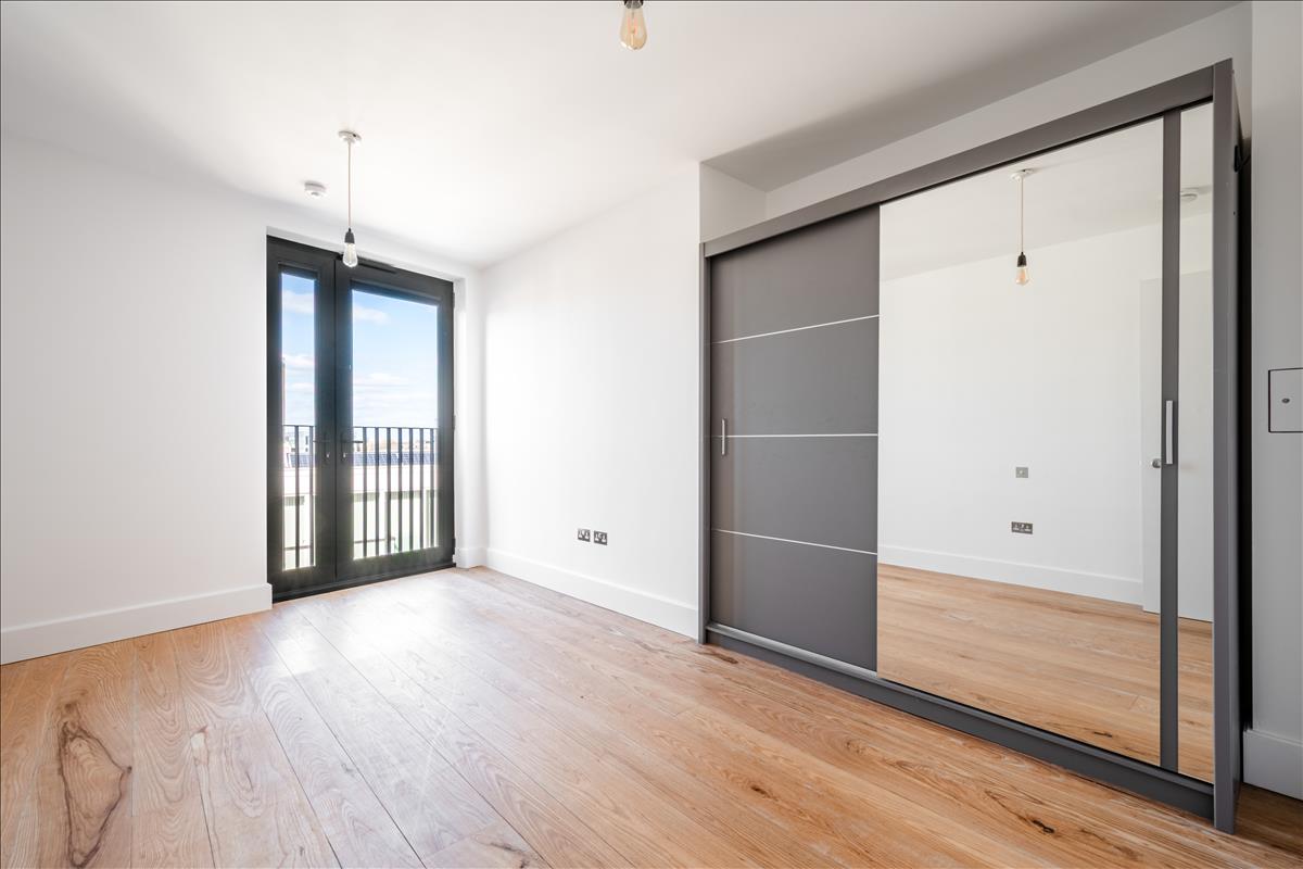 Bedroon - A stunning three-bedroom, two-bathroom split-level “sky house” apartment set across the fifth and sixth floors in the heart of London Fields.