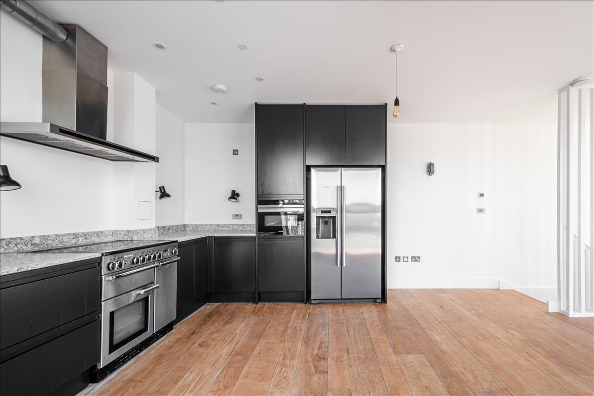 Kitchen - A stunning three-bedroom, two-bathroom split-level “sky house” apartment set across the fifth and sixth floors in the heart of London Fields.
