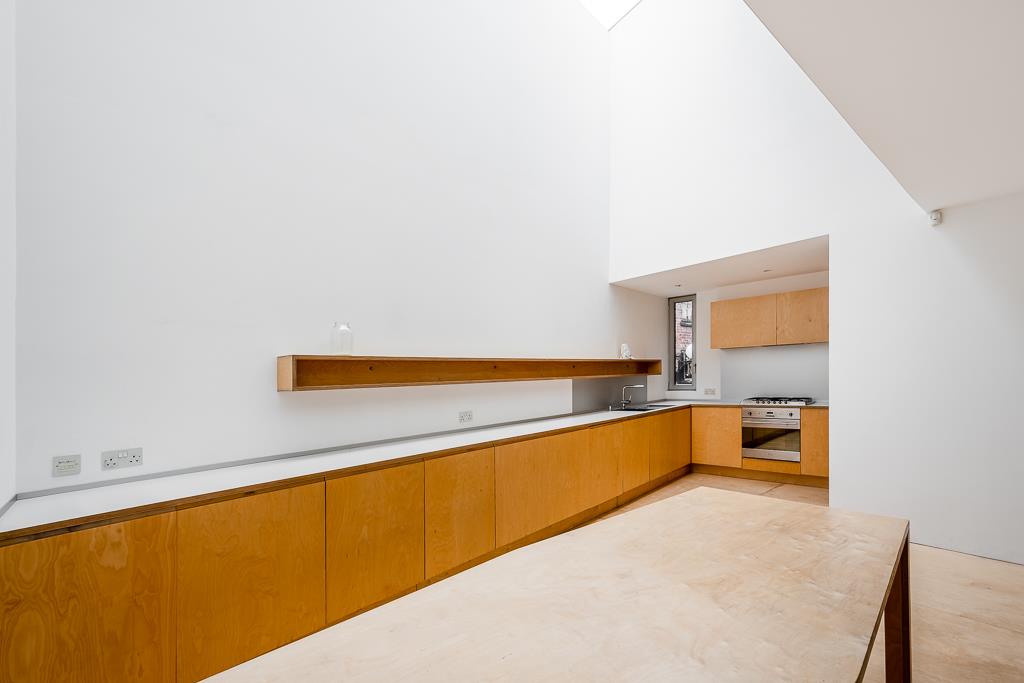 Modern bright architecturally designed house Shoreditch roof light vaulted ceiling kitchen