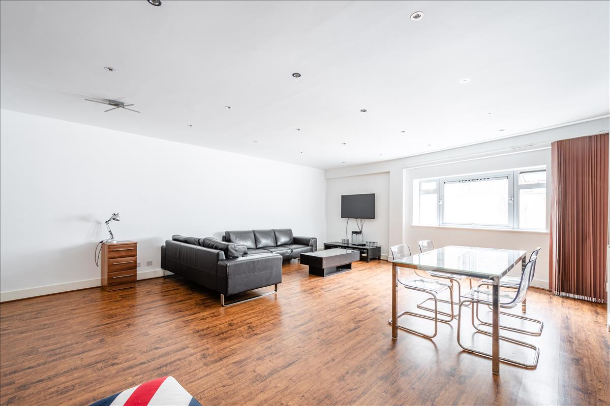Living Room - An exceptional three-bedroom, two-bathroom split-level apartment, ideally situated in the heart of London’s renowned jewellery quarter, Hatton Garden.