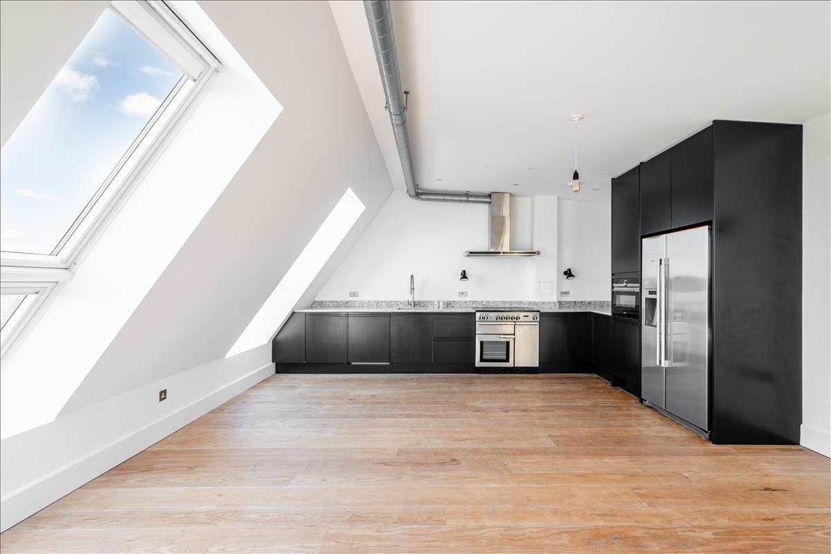 Kitchen - A stunning three-bedroom, two-bathroom split-level “sky house” apartment set across the fifth and sixth floors in the heart of London Fields.