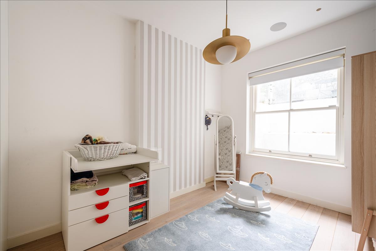 Second bedroom. Three bedroom split-level duplex apartment for sale on Orde 