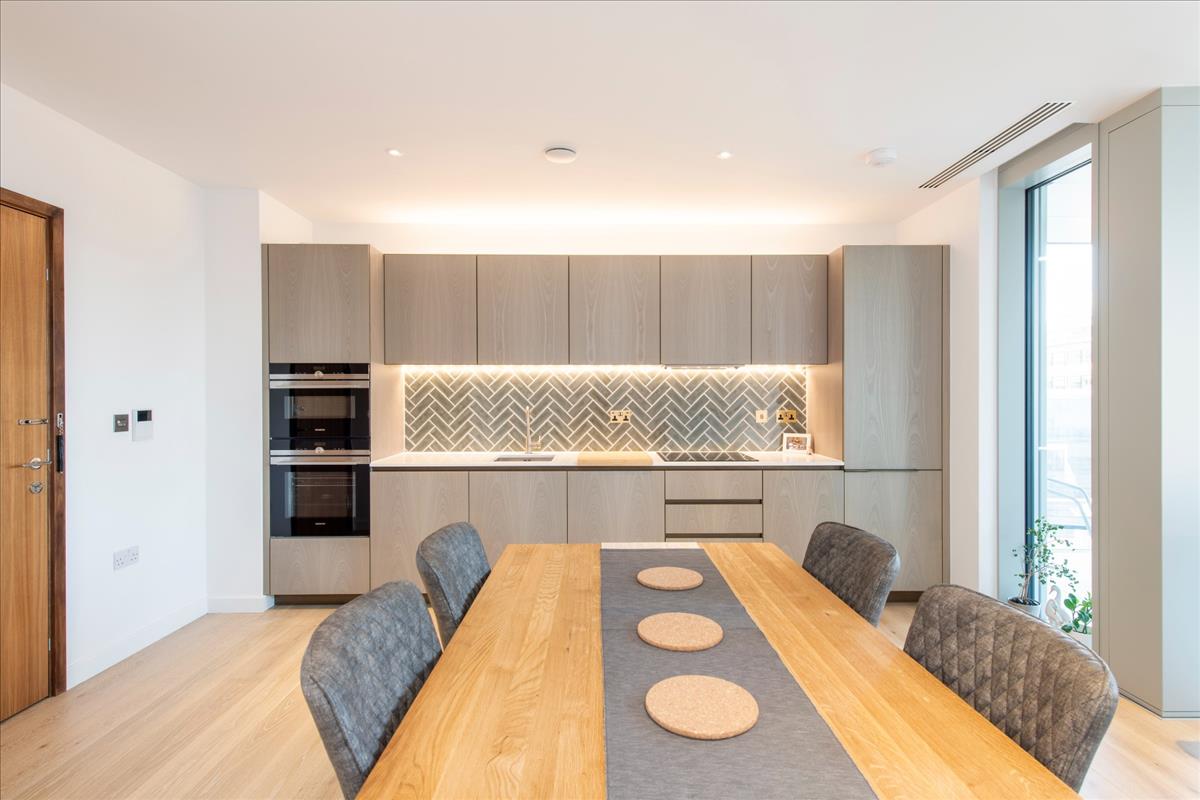 Interior photo of the lit up kitchen in an Atlas Building apartment