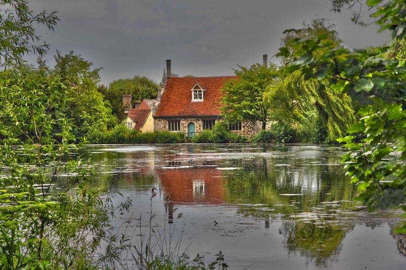A small house in a body of water
Description automatically generated